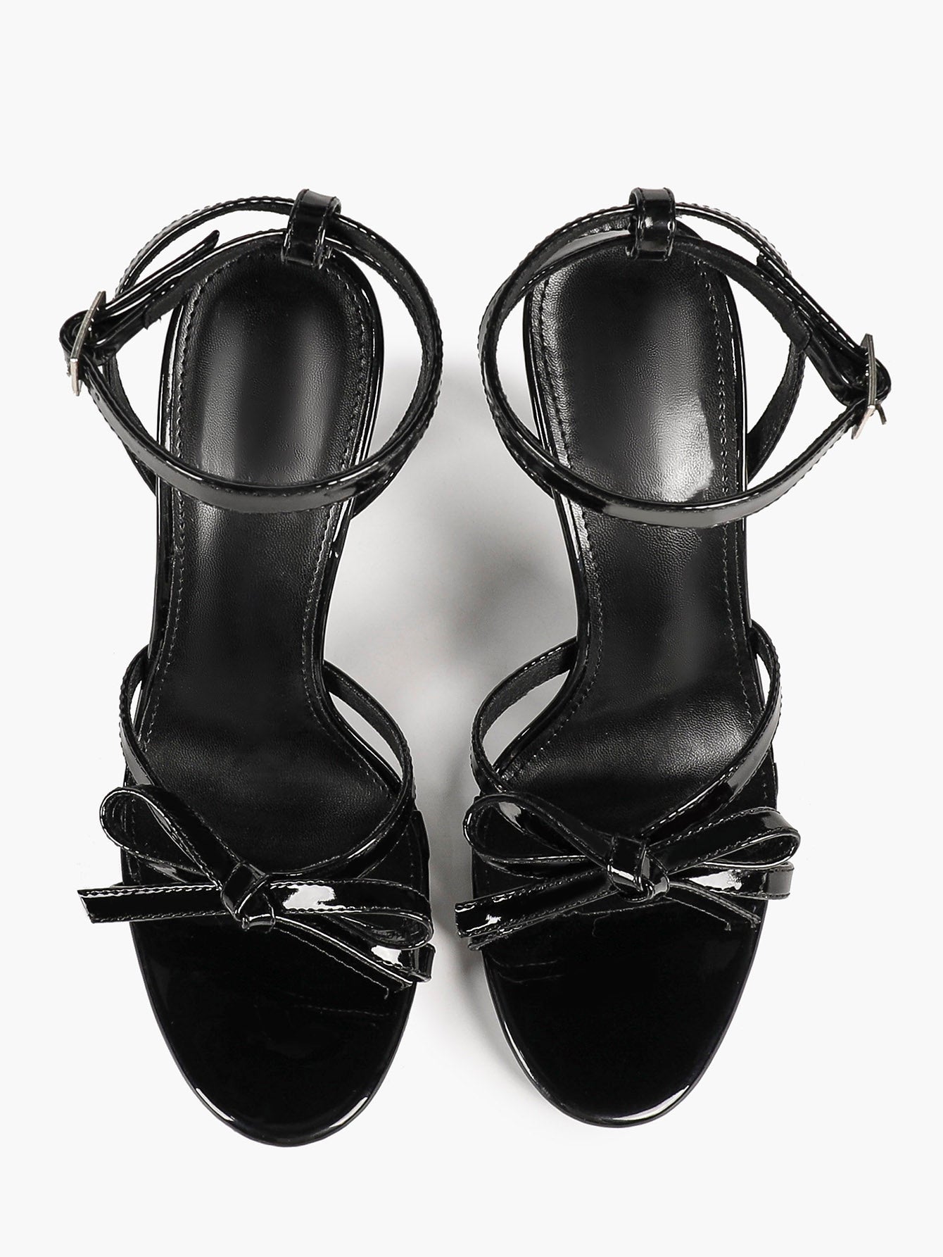 Architectural Bow Stilettos: Glossy Black Multi-Strap Heels for Modern Chic