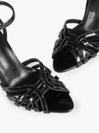 Urban Lattice: Black Patent Cage-Strap Stilettos for the Modern Power Woman