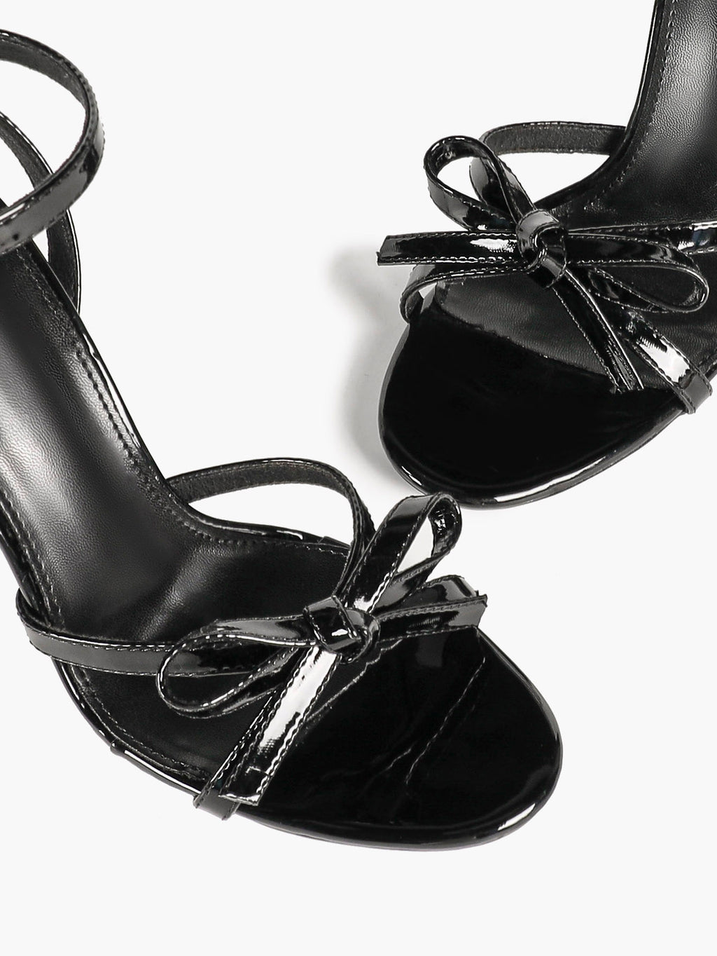 Architectural Bow Stilettos: Glossy Black Multi-Strap Heels for Modern Chic