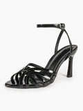 Urban Lattice: Black Patent Cage-Strap Stilettos for the Modern Power Woman
