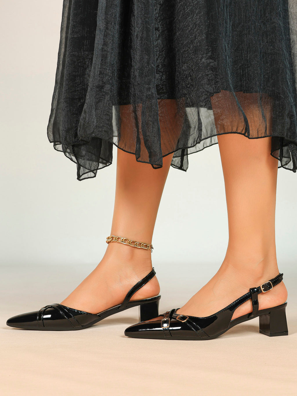 Black Patent Pointed-Toe Slingback Pumps with Double Gold-Tone Buckle Straps